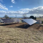 Ground-mounted solar panel installation in a rural setting
