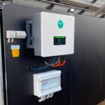 Solar inverter system installed on a metal frame under solar panels