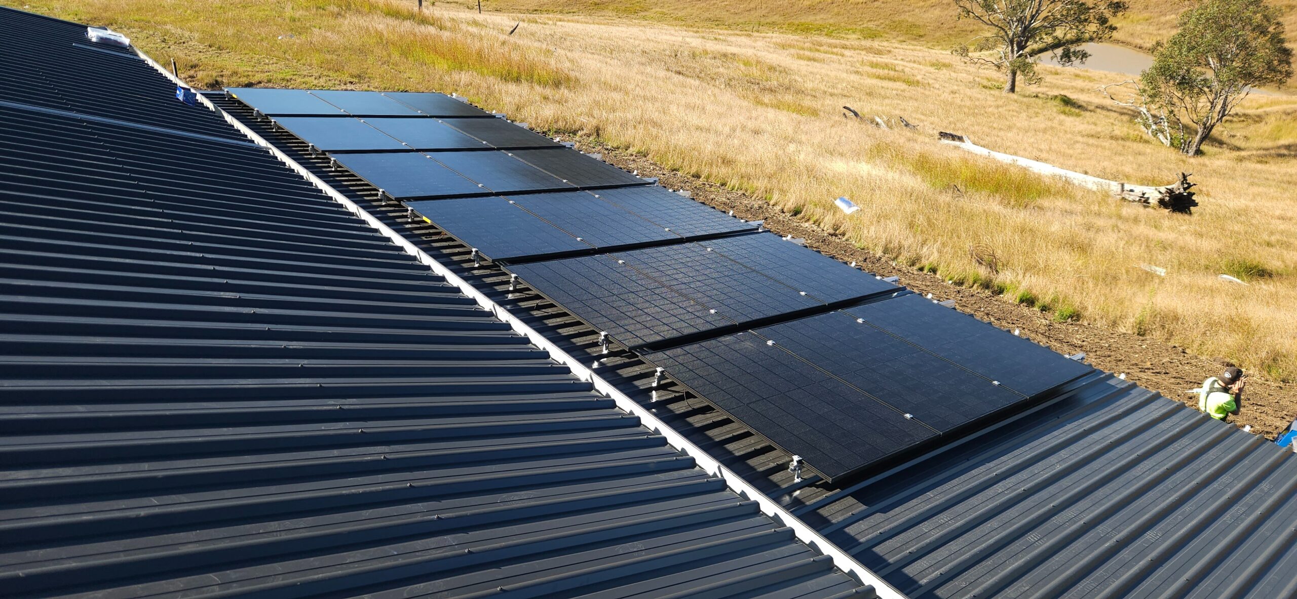 Rooftop solar panel installation on a metal roof