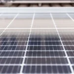 Close-up view of solar panel surface showing cell texture and detail.