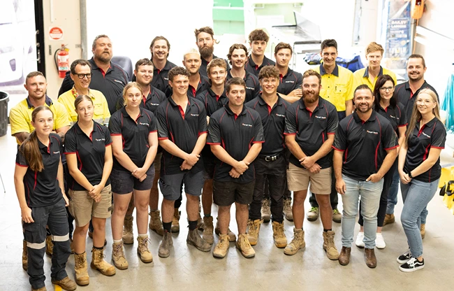 Bright Spark Group solar installation team in Ipswich standing together in the workshop