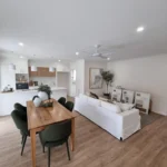 Bright and modern residential living space showcasing professional electrical fit-out, including energy-efficient lighting and power outlets.