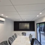 Modern Brisbane dining area featuring a professionally installed split-system air conditioner for efficient indoor climate control and year-round comfort.