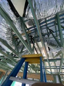 Installation of ducted air conditioning system in a Brisbane home, with ceiling-mounted ducts providing discreet, whole-home climate control.