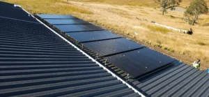 Bright Spark Group installing solar panels on rural metal roof for sustainable solar power system