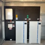 Deye solar battery storage system installation featuring dual white lithium battery towers and wall-mounted inverter for residential renewable energy storage solution
