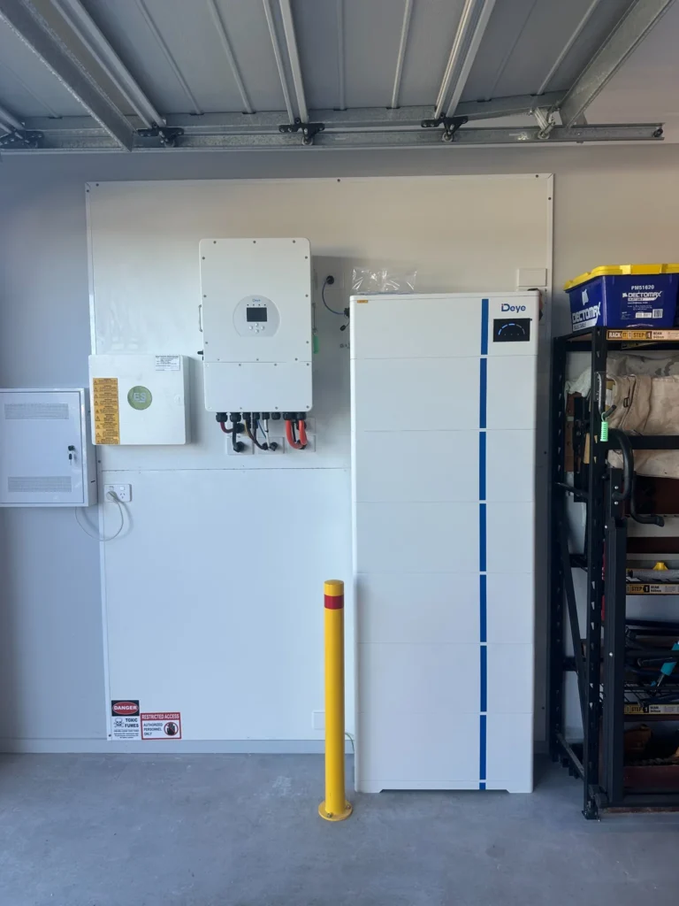 Bright Spark Group garage solar battery storage system with Deye inverter and wall-mounted energy management setup