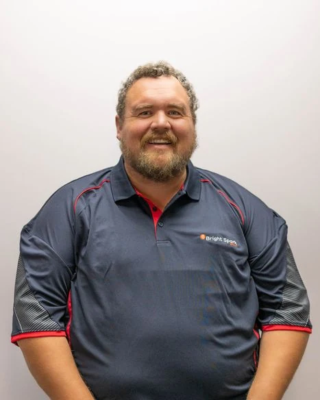 Bright Spark Group electrician team member Andrew Coultis in BSG work shirt