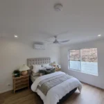 Bedroom with ceiling fan and electrical fitout completed for a Queensland home