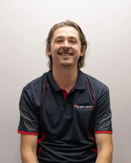 Bright Spark Group electrician team member Luke Stacey in BSG work shirt