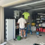 Solar battery and inverter installation in a Queensland garage by Bright Spark Group electricians