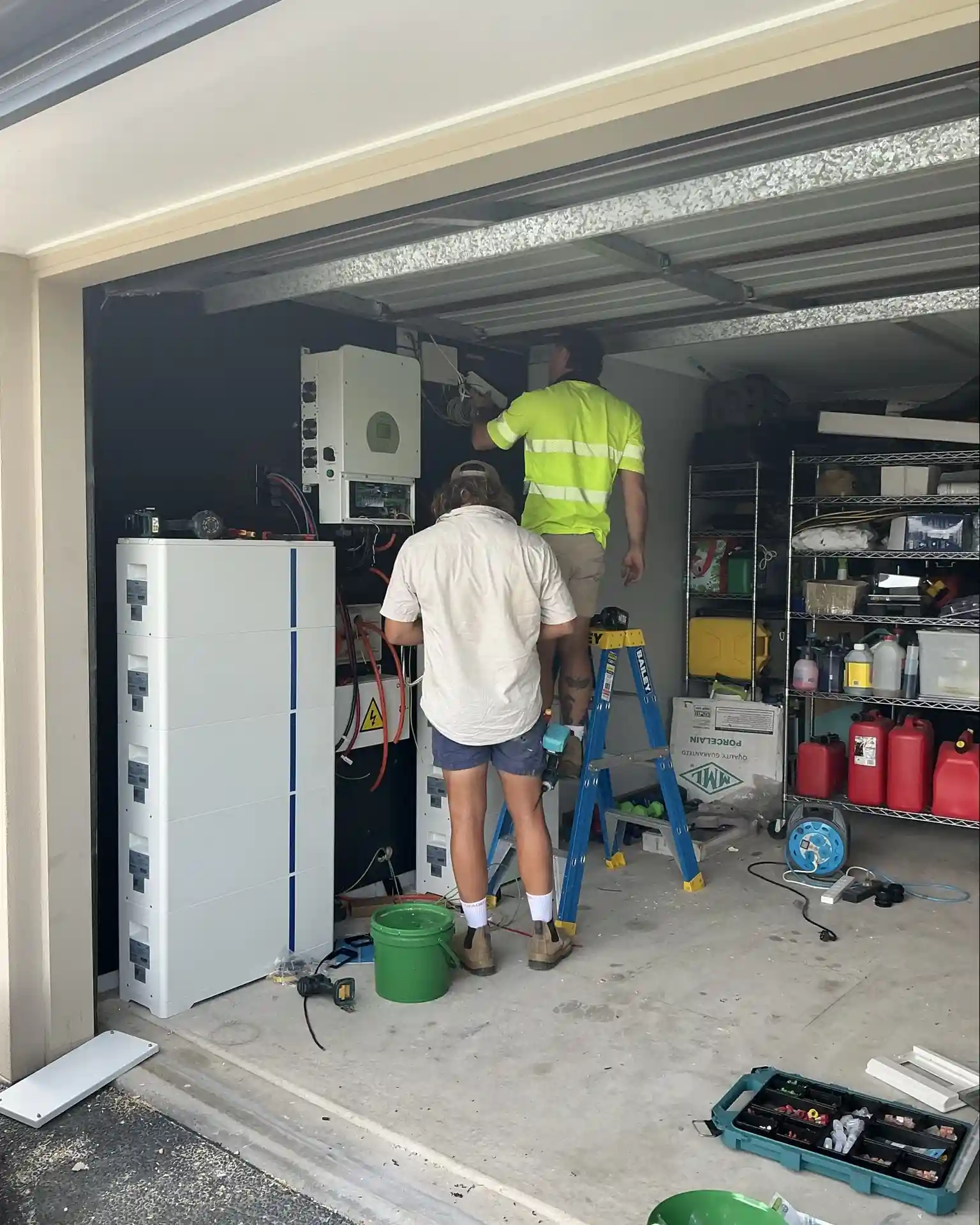 Solar battery and inverter installation in a Queensland garage by Bright Spark Group electricians