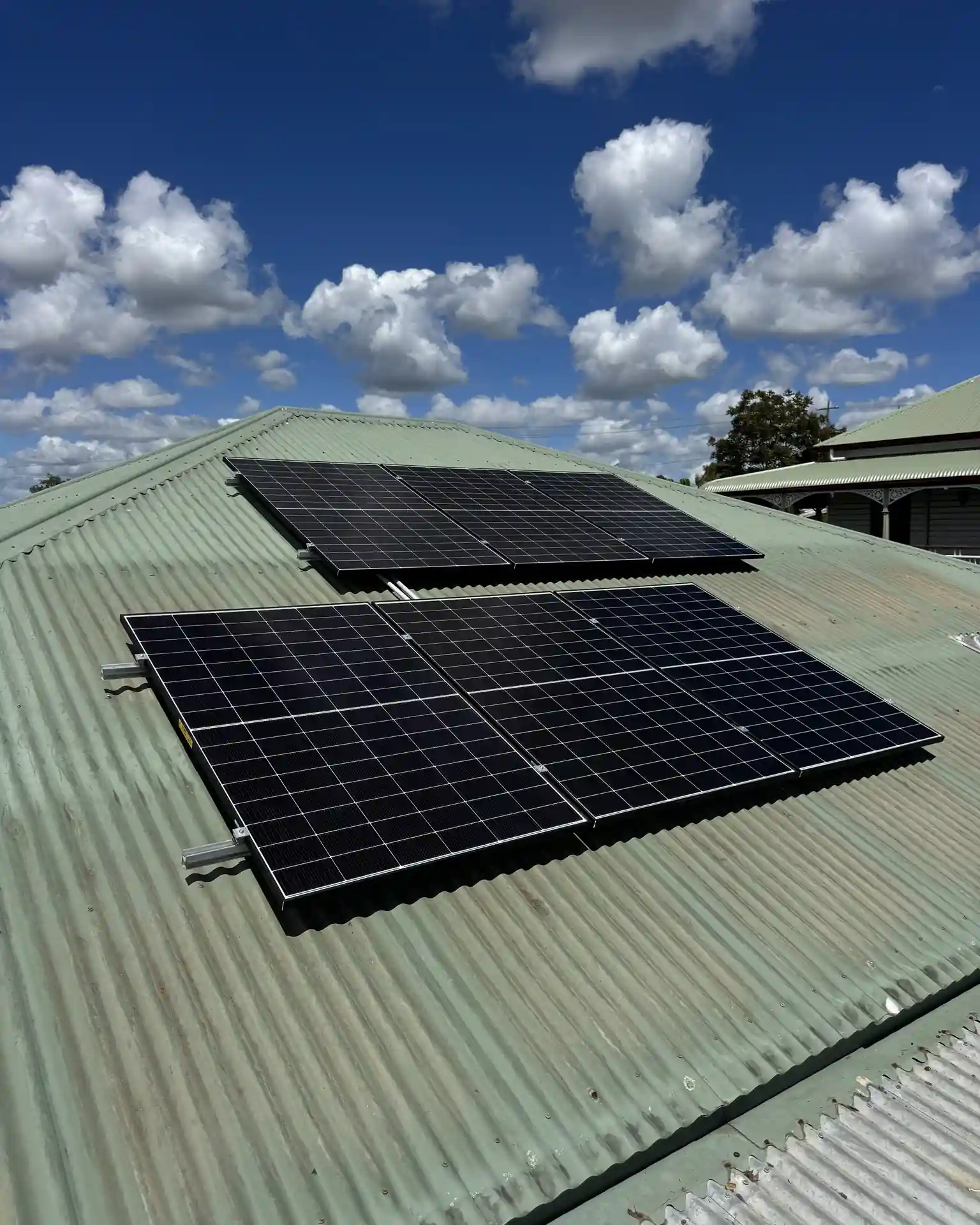 Solar panel installation on a Queensland metal roof by Bright Spark Group
