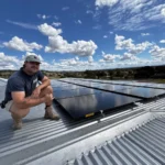 Bright Spark Group team inspecting rooftop solar panels for safe solar performance in Queensland