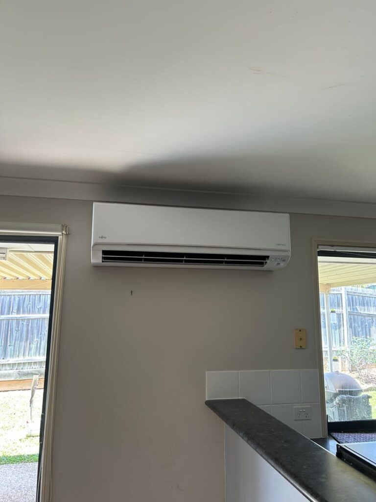 Fujitsu Airstage split system air conditioner in an open-plan living area