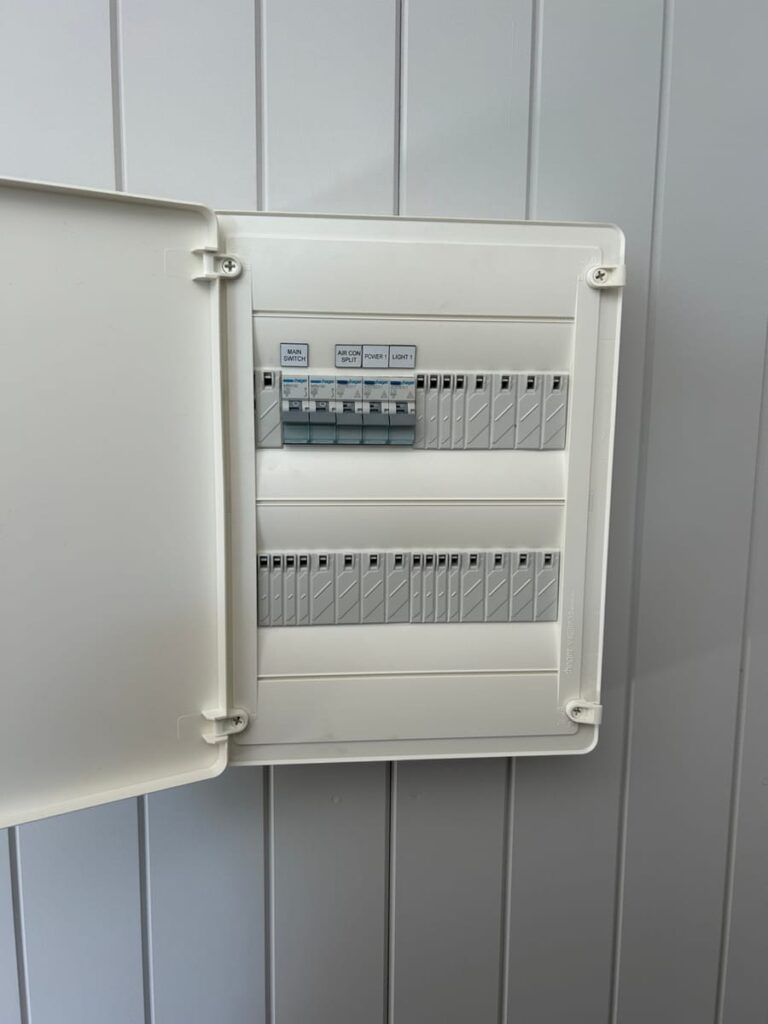 Labelled switchboard with main switch, air conditioning, power and light circuits