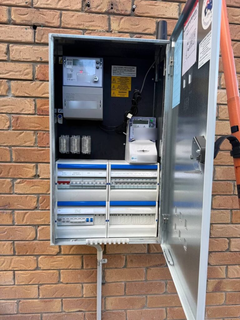 Outdoor meter box and switchboard wired for solar and battery with shutdown procedure labels