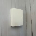 Switchboard enclosure installed on a wall