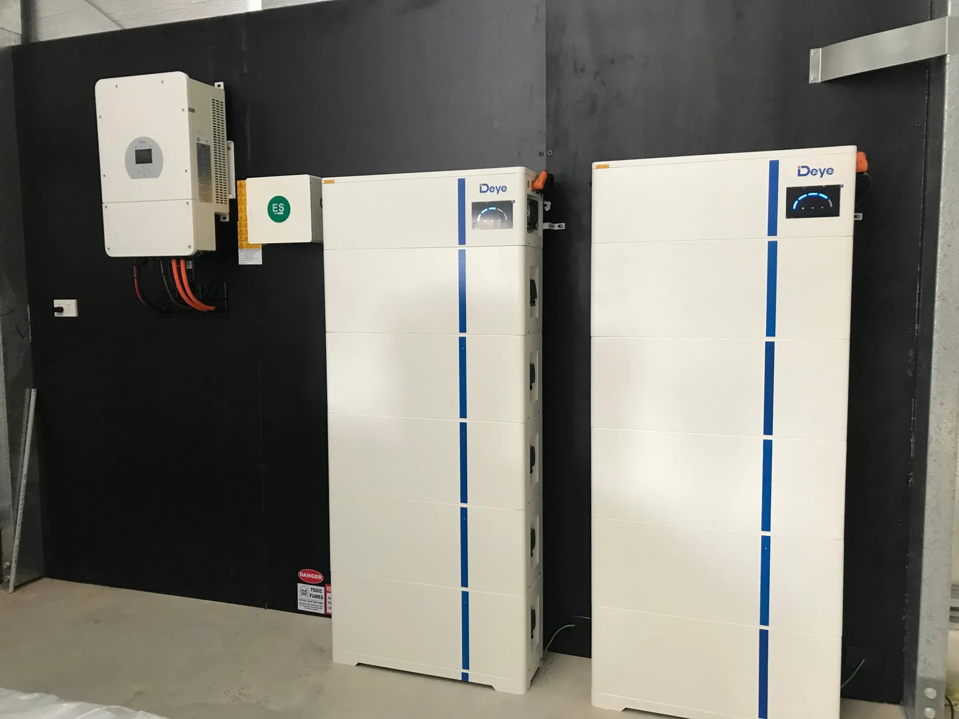 Deye inverter and two stacked Deye battery units installed on a wall