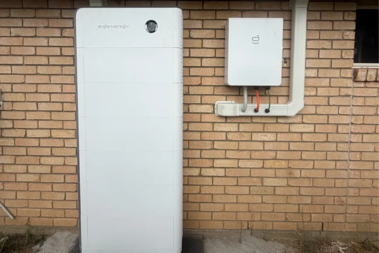 Sigenergy home battery tower and gateway fixed to a brick wall, installed by Bright Spark Group
