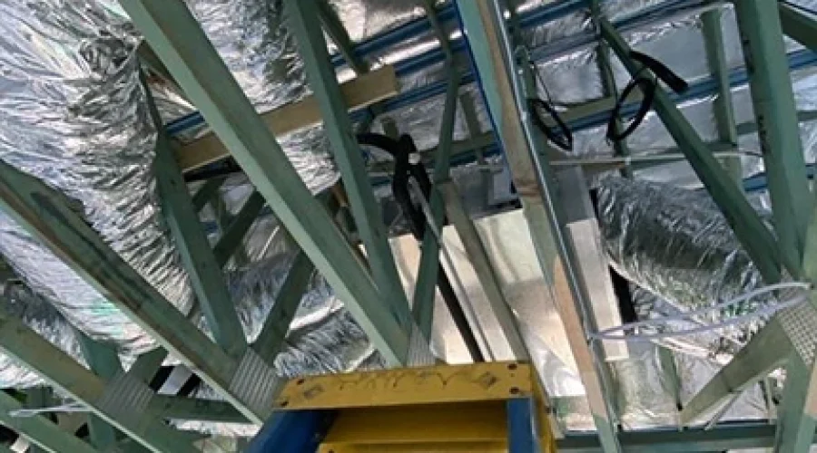 Installation of ducted air conditioning system in a Brisbane home, with ceiling-mounted ducts providing discreet, whole-home climate control.