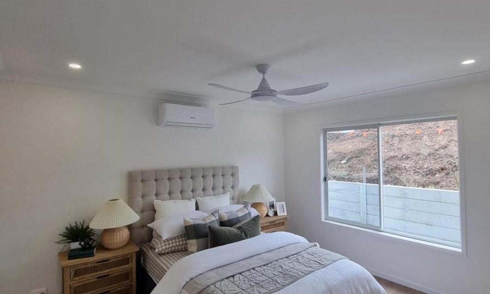 Bedroom with a smoke alarm, ceiling fan and downlights installed