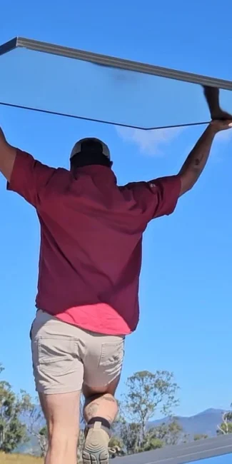 Bright Spark Group solar technician installing high efficiency solar panel system