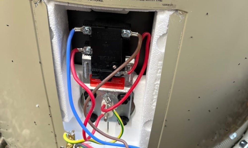 Hot water system thermostat and element wiring with the cover open